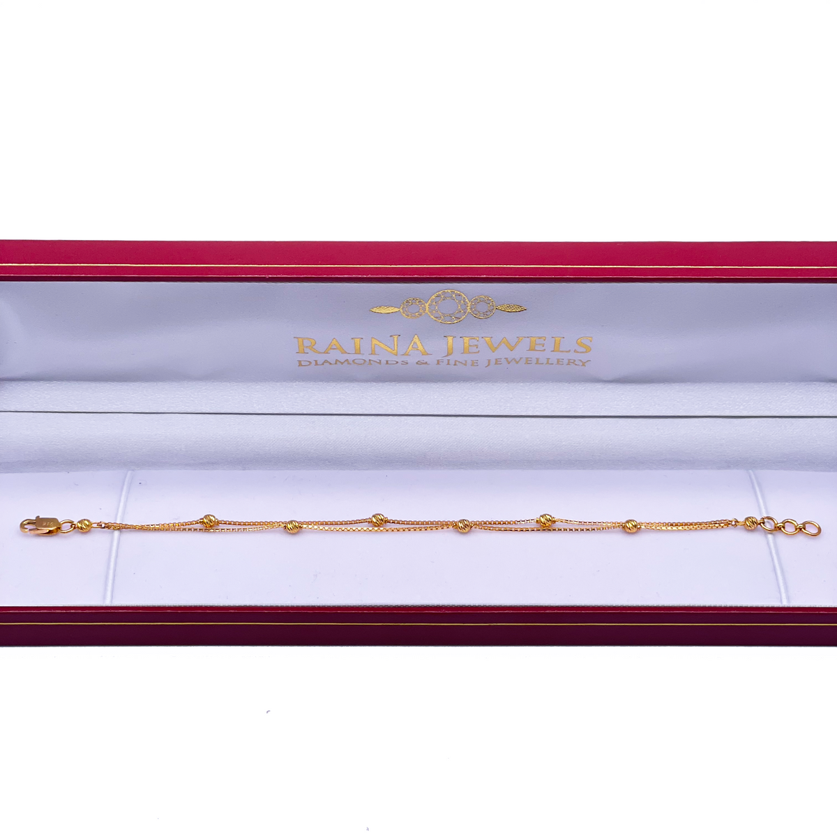 Bracelet double chaîne en or jaune 22 carats avec perles taillées en diamant