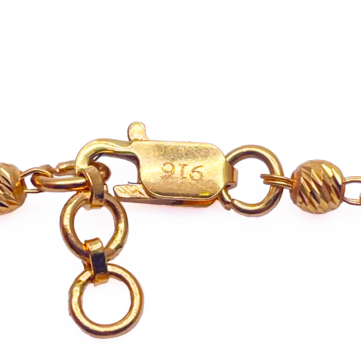 Bracelet double chaîne en or jaune 22 carats avec perles taillées en diamant