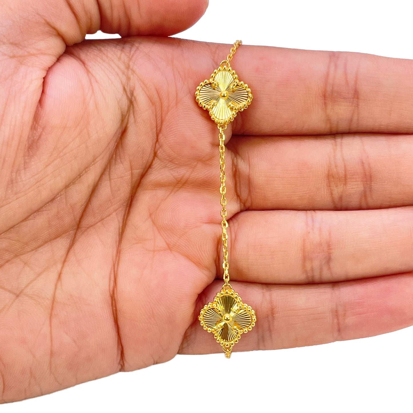 Bracelet 7,5 pouces en or jaune 22 carats avec 5 trèfles floraux taillés en diamant